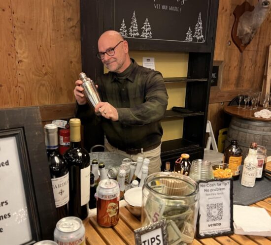 George, ranch owner, preparing a fall cocktail for a guest off screen